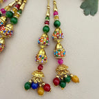 Multicolour jhumka latkan tassel with ruler showing 14cm length