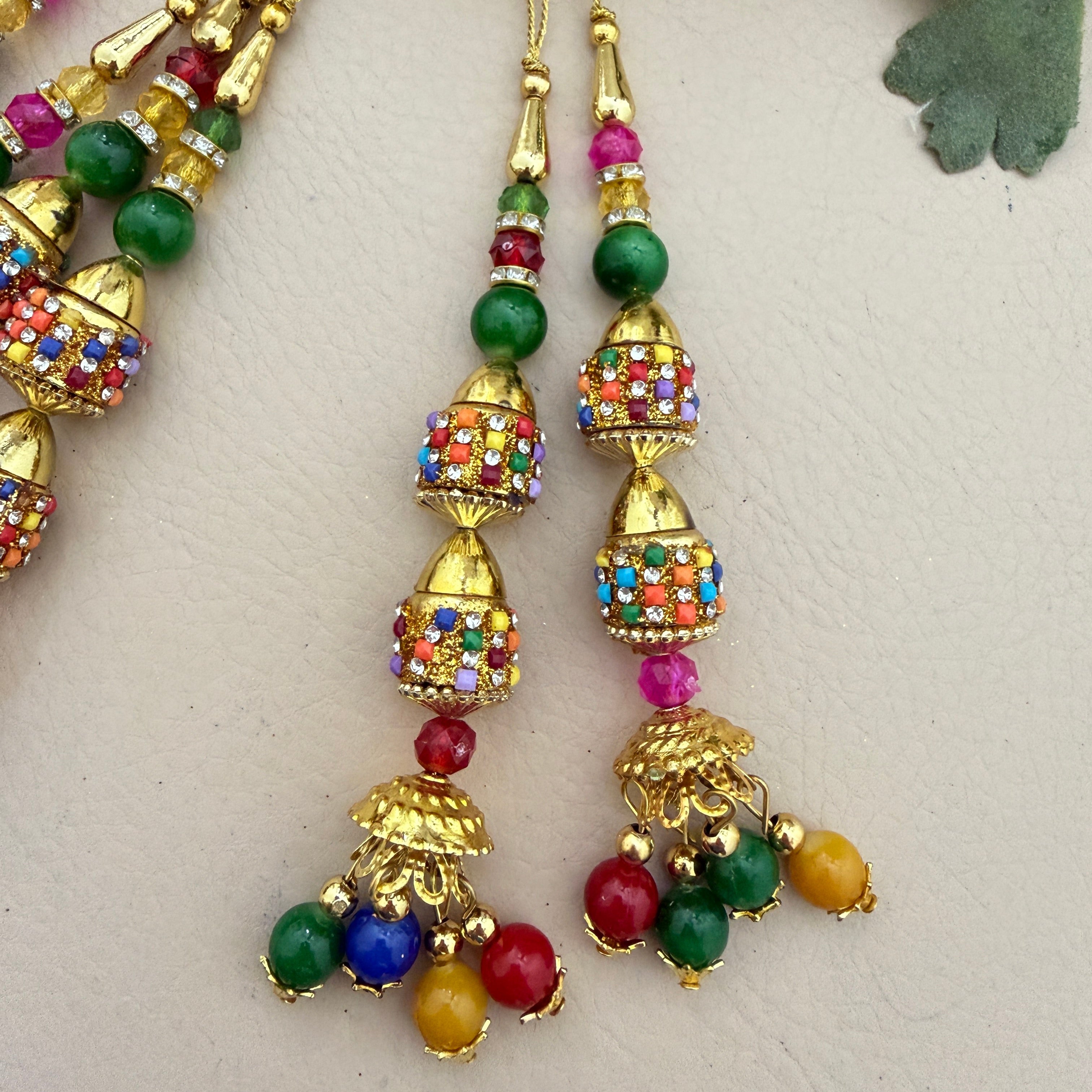 Multicolour jhumka latkan tassel with ruler showing 14cm length