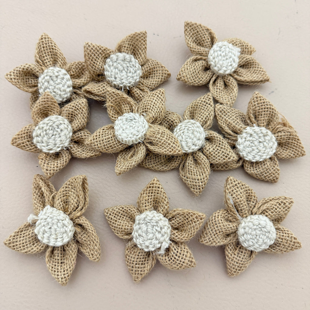 Single handmade jute burlap flower patch with ruler showing 7cm size