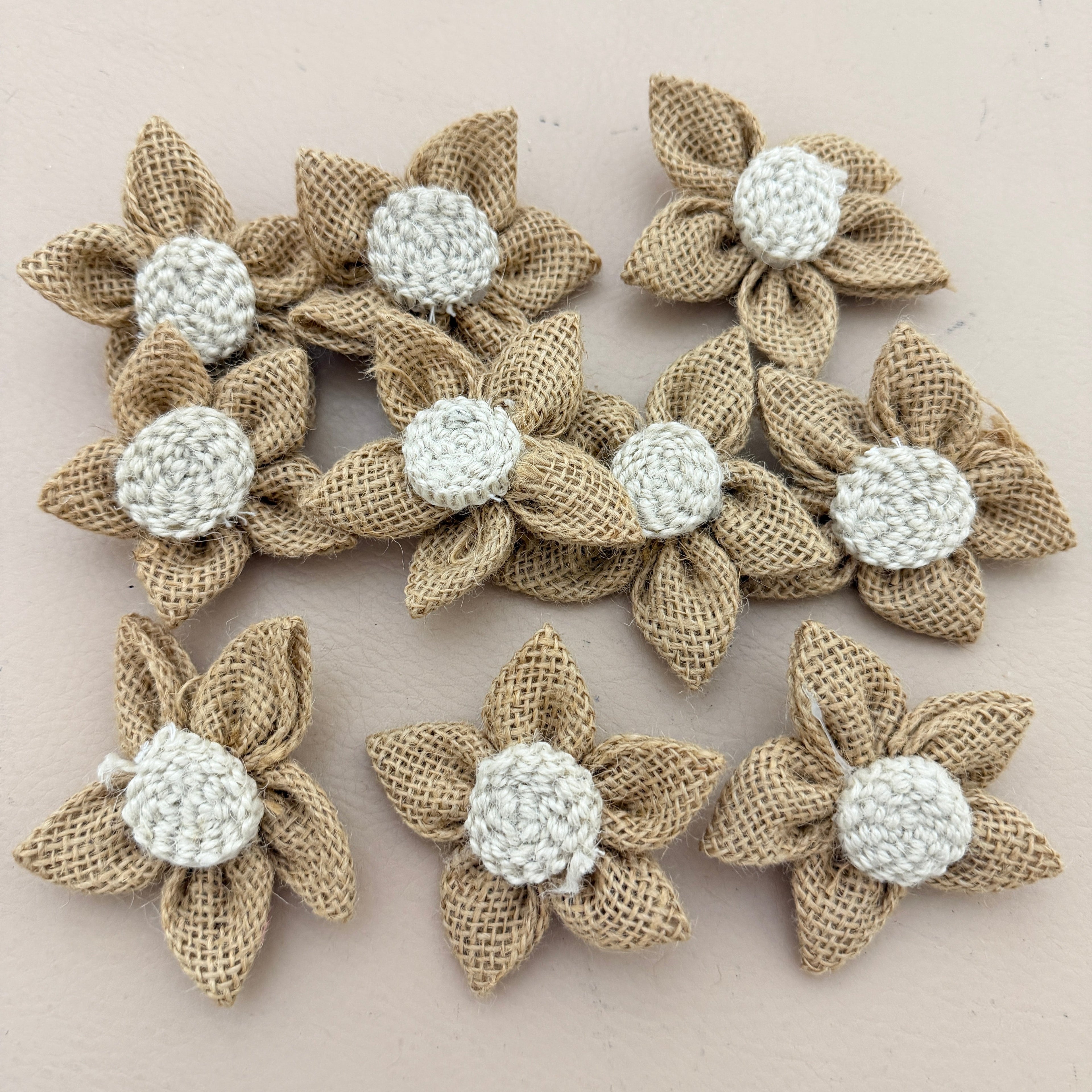 Single handmade jute burlap flower patch with ruler showing 7cm size