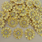 Close-up of multiple yellow floral rhinestone patches