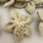Close-up of jute burlap flower patch showing white crochet centre detail